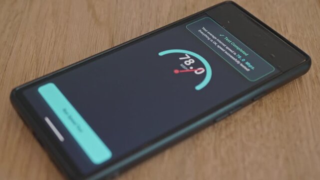 The concept of stable and good mobile internet speed. Digital UI on smartphone screen measuring data connection speed in megabits per second
