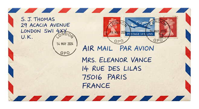 Vintage airmail envelope with stamps and handwritten addresses from London to Paris