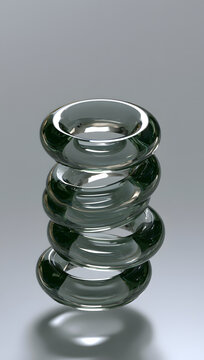 Floating glass rings stacked vertically, reflecting glossy surfaces.