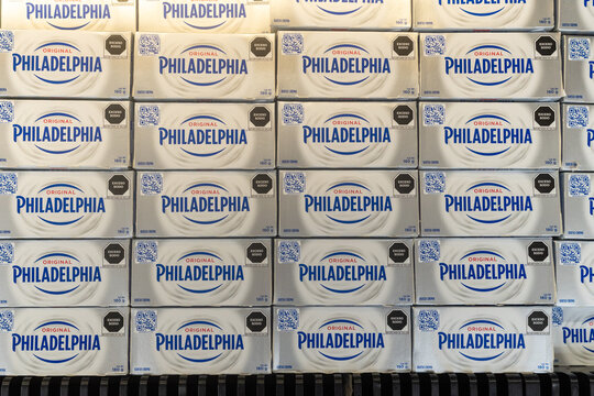 Villa de Alvarez, Colima. Mexico. June 24, 2026: Rows of Philadelphia Cream Cheese Blocks Stocked on a Supermarket Refrigerated Shelf