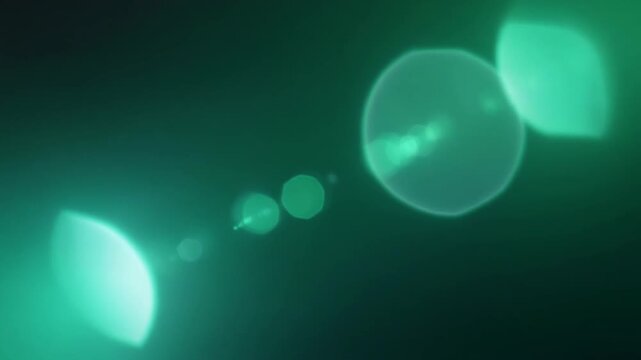 Emerald green cinematic light leak overlay with jade, mint gradients, realistic lens flare, optical reflections, dreamy atmospheric glow, seamless looping texture for professional video editing.