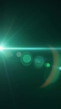 Emerald green cinematic light leak lens flare overlay