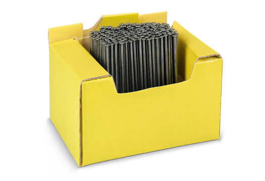 Group of metal rods standing upright inside a small yellow cardboard box with industrial components hardware
