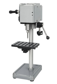 Industrial bench top drill press machine on white background with heavy duty industrial metalworking workshop