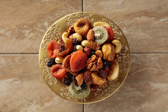 Assortment of dried tropical fruits, nuts and raisins.