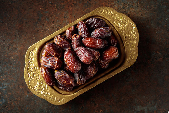 Dates on a golden platter.