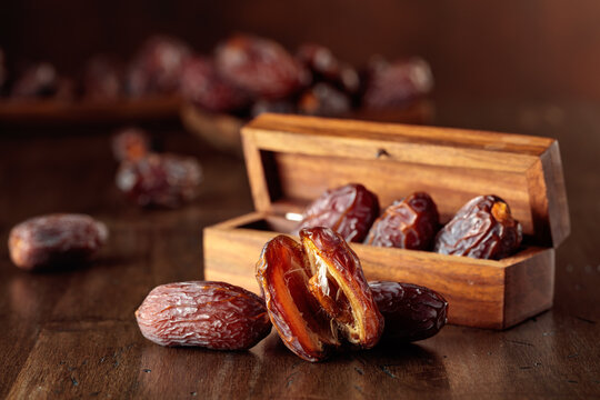 Dates fruit on an old wooden table.