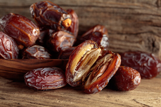 Dates fruit on an old wooden table.