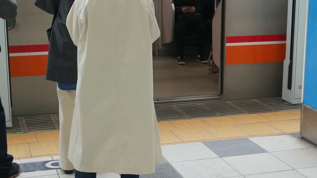low angle view to floor while passenger que up waiting for arrival subway train commuter at Tokyo subway platform station.tokyo subway platform public transportation&nbsp;