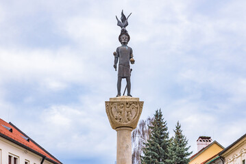The historic bronze statue of King Saint Stephen (Szent Istvan) on a tall stone column at Kossuth Square under a cloudy winter sky.