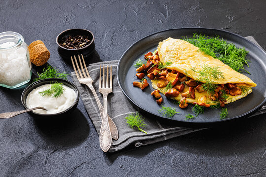 Egg omelet with fried wild chanterelles and dill