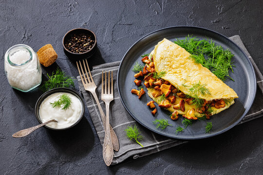 Egg omelet with fried wild chanterelles and dill