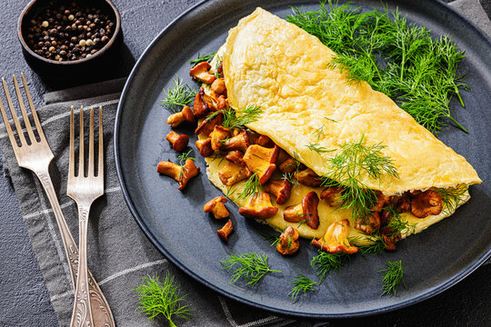 Egg omelet with fried wild chanterelles and dill