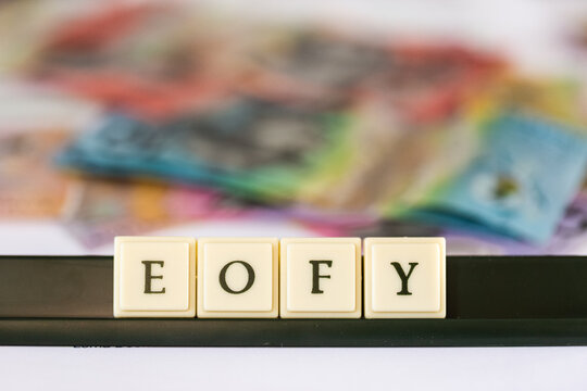 EOFY tax time concept with Australian banknotes in background
