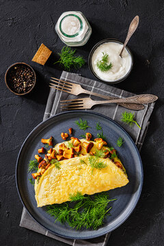 Egg omelet with fried wild chanterelles and dill