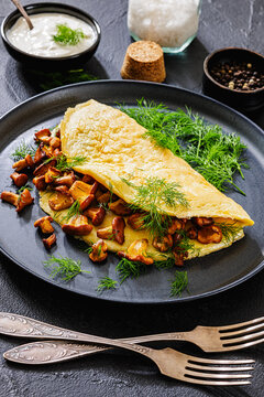 Egg omelet with fried wild chanterelles and dill