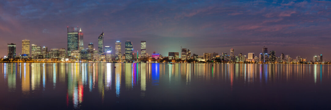 The Perth city skyline and reflection in the swan river at night