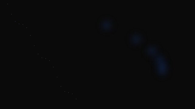 A single faint patch of glowing blue light against a deep black background