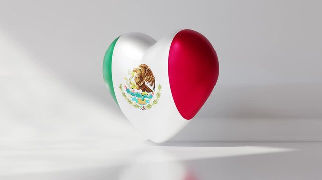 A heart shape features the design of the Mexico flag. The colors green, white, and red blend together. The eagle and snake emblem is displayed clearly. This shows national pride