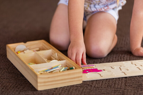 child playing with bear puzzle