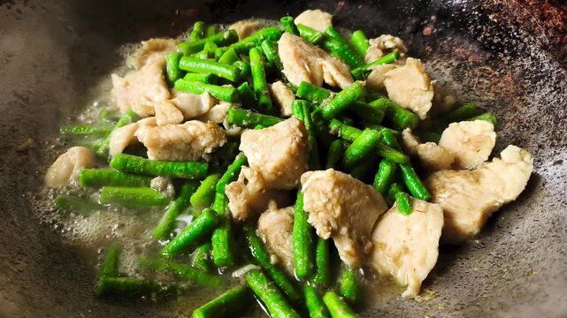 Frying long bean with chili paste, indoor Chiangmai Thailand.