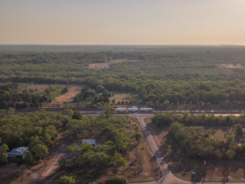 Road train travelling northbound to Darwin along Stuart Highway with smoke haze