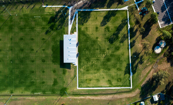 Alroy oval sports ground with new clubhouse building by green playing field