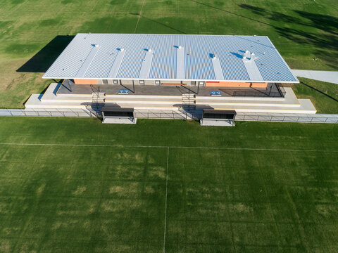 Alroy oval sports ground with new clubhouse building between fields