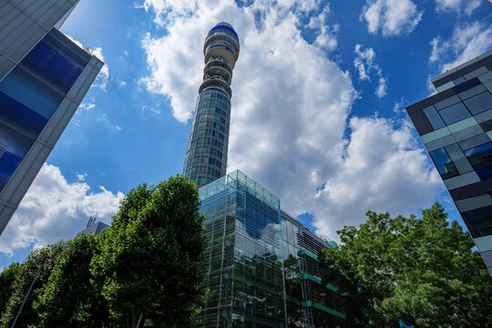 London - 07 14 2022: Howland and Fitzroy Street intersection with BT Tower and modern fa&ccedil;ade