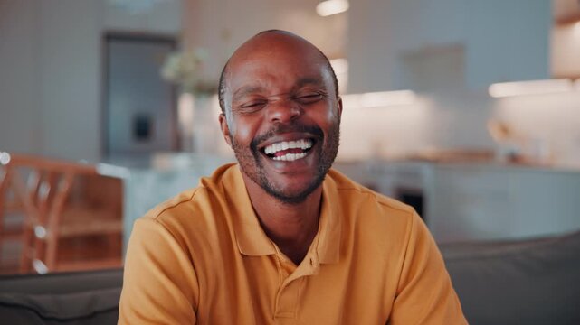 Face, funny and black man in home to relax on break, wellness or staycation on weekend with happiness. Portrait, smile and mature person at living room to chill, laugh and positive attitude on sofa