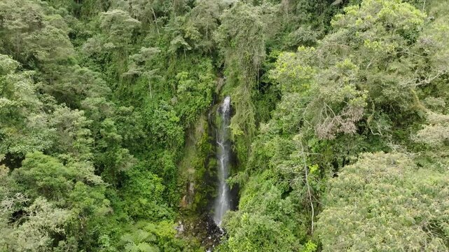 great and magical water waterfall in the exuberant natural forest mountain with drone aerial view