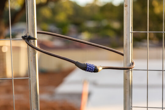combination lock close up for worksite fence