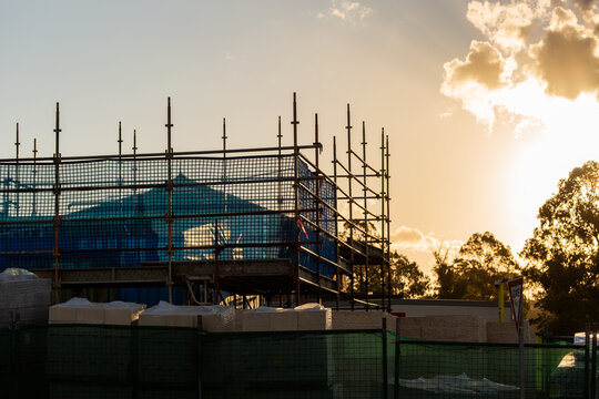 multi storey commercial worksite with scaffolding rising up around building under construction
