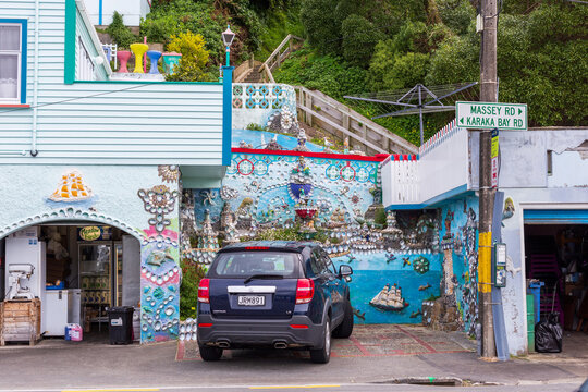 A vibrantly decorated mosaic‑covered building sits at the corner of Massey Road and Karaka Bay Road in Wellington, New Zealand