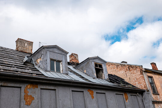 Fire Damaged Roof of an Old Residential Building With Severe Structural Damage