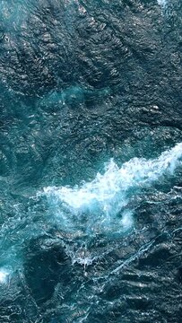 Blue waves of water of the river and the sea meet each other during high tide and low tide.
