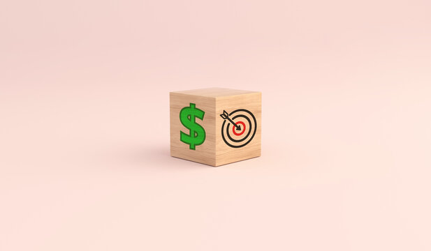 Wooden cube showing dollar sign and target icon