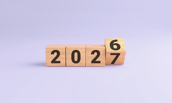 Transitioning from the year 2026 to 2027 on wooden blocks, symbolizing progress and future plans