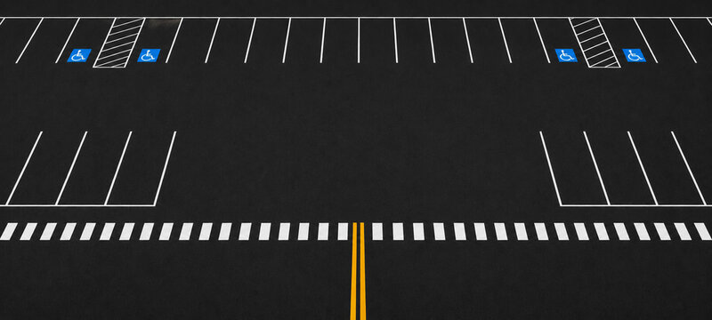 Empty parking lot with handicap spaces. Asphalt car park with road markings.