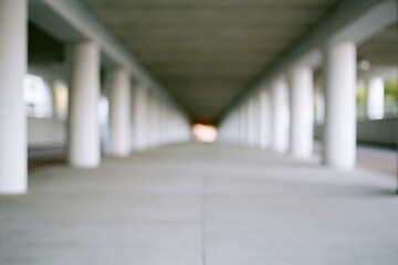 Obraz premium The Long Concrete Corridor Underpass with Repeating Pillars and Vanishing Point
