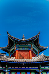 Fototapeta premium Traditional Chinese temple roof under blue sky