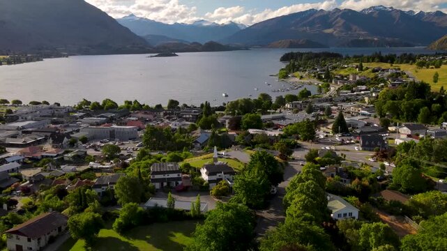 Aerial view of Wanaka township and lake in New Zealand during bright summer day.