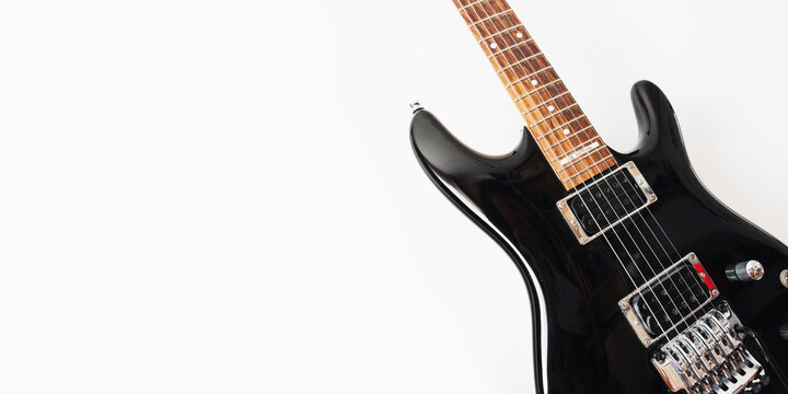 May 11, 2026, Częstochowa, Poland - Gibson and Ibanez Electric Guitars Hanging on White Wall