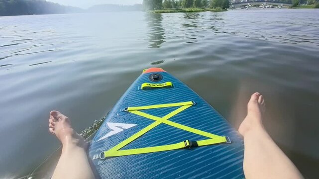 POV shot of paddleboard nose gliding on endless blue sea surface on sunny summer day, tropical resort tourism and luxury ocean travel b-roll footage