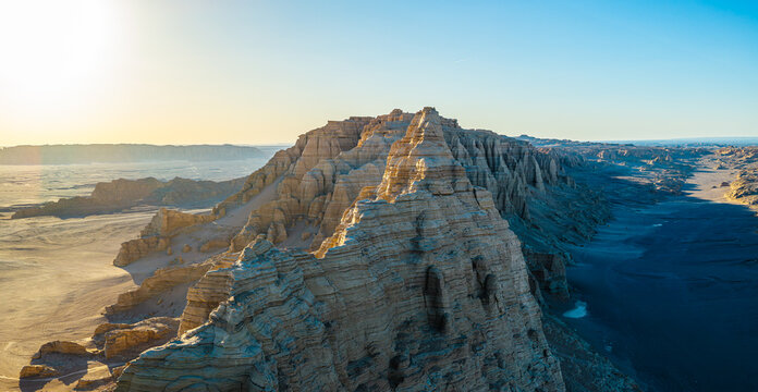 Aerial view of majestic yardang landforms in the Gobi Desert at sunset, Dahaidao, Xinjiang, China