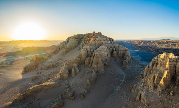 Aerial view of majestic yardang landforms in the Gobi Desert at sunset, Dahaidao, Xinjiang, China