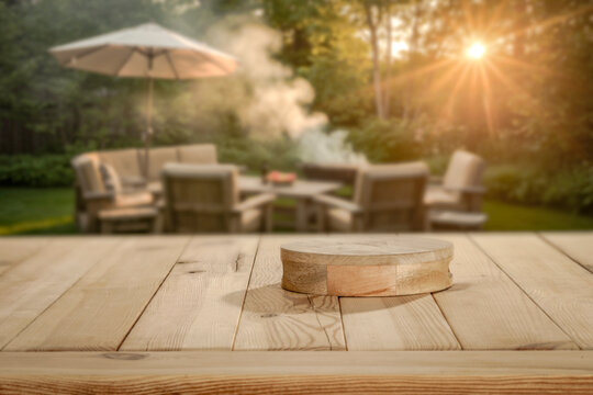 Wooden table with copy space and blurred summer barbecue background