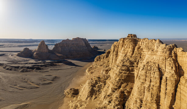 Aerial view of majestic yardang landforms in Gobi Desert at sunset, Dahaidao, Xinjiang, China