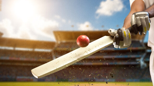 Cricket bat striking red ball in dramatic close up with stadium background and flying debris. Concept of powerful batting, sports marketing, tournament branding, competition and advertising.