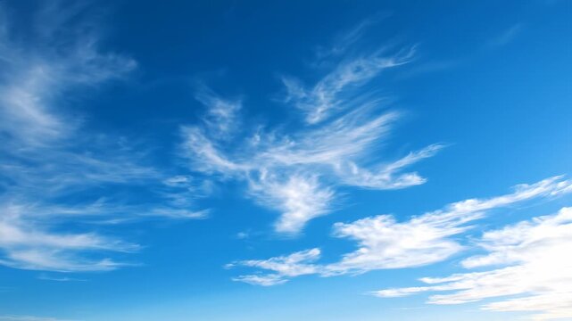 Blue Sky with White Wispy Clouds Drifting. Serene Sunny Weather Nature Background Footage.